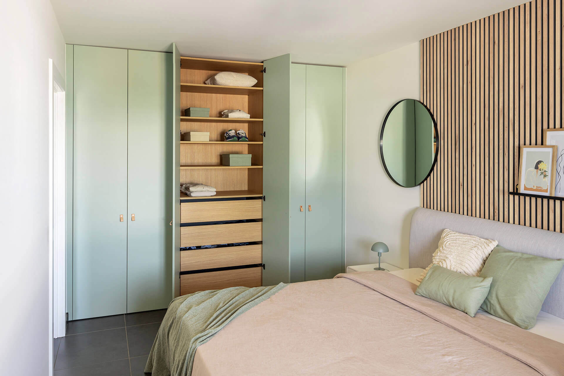 A custom-made dressing closet in a bedroom combined with an accent wall with acoustic panels in Ivory Oak