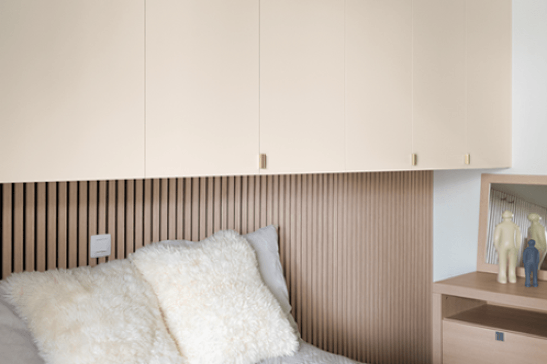 Ivory Oak acoustic wall panels behind the bed, with a ceiling cabinet in Seashell