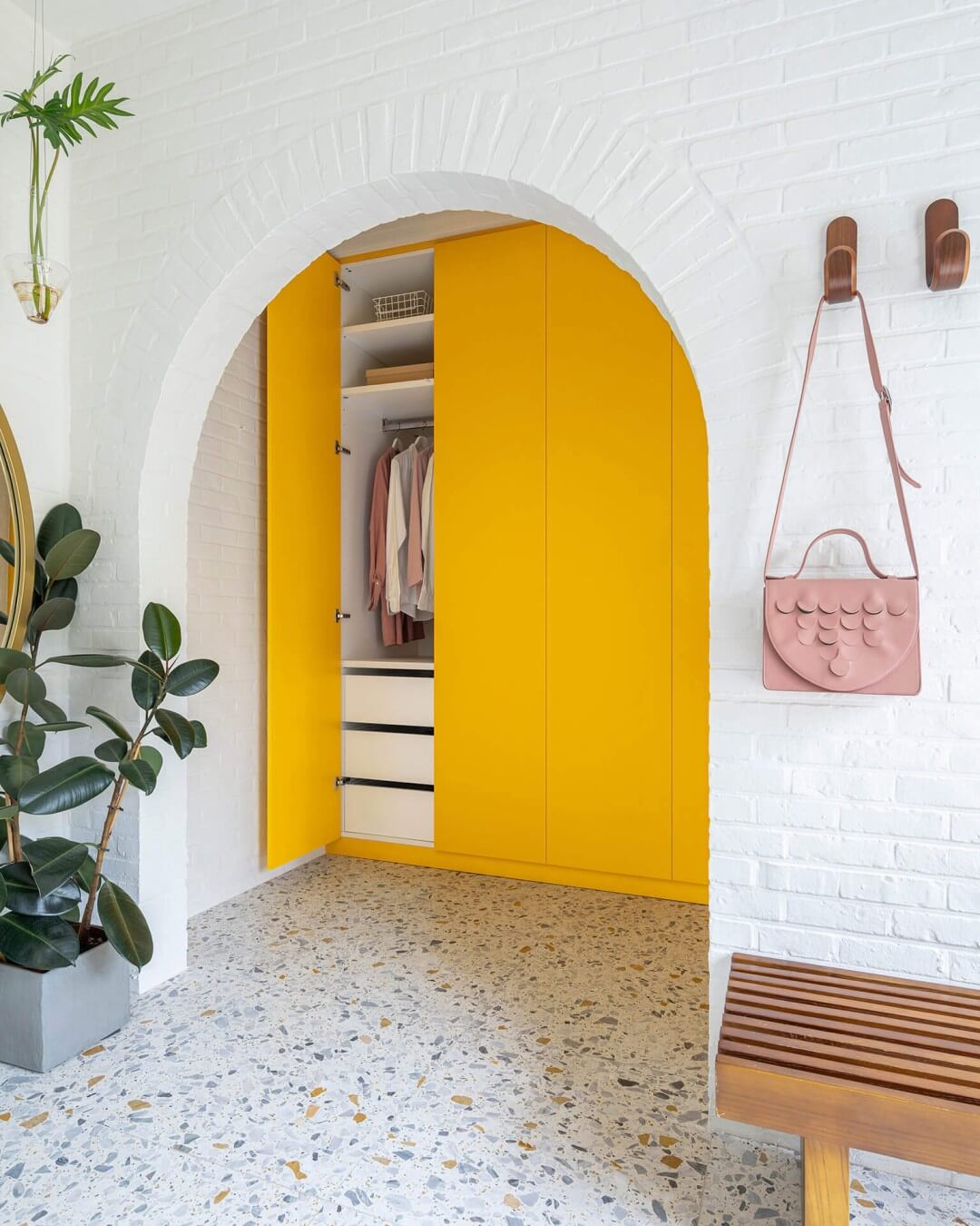 custom-made yellow wardrobe in a sixties bungalow
