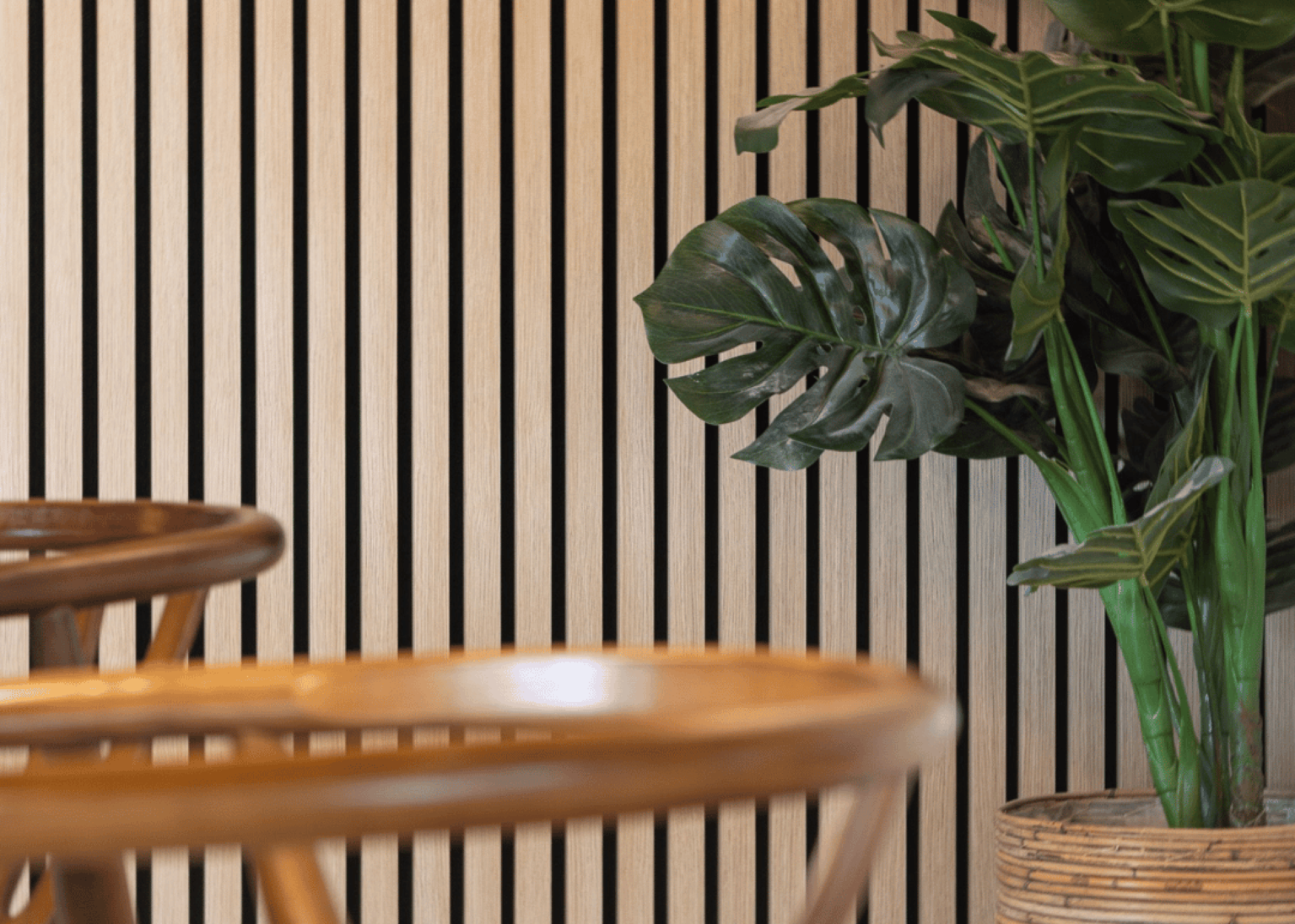 Close-up of the slats of acoustic wall panels in Ivory Oak