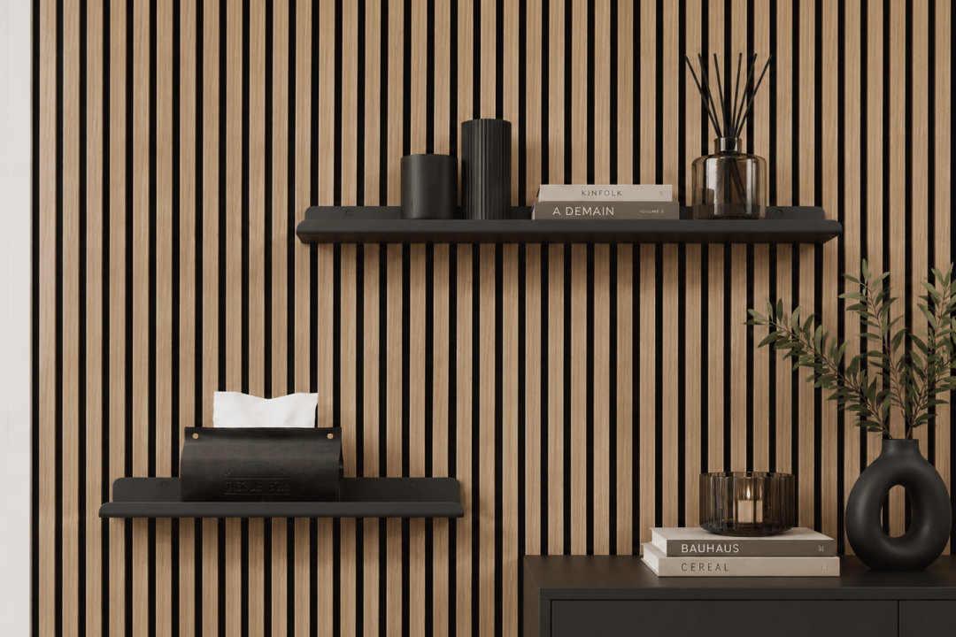 Acoustic wall panels with wall shelves next to a door