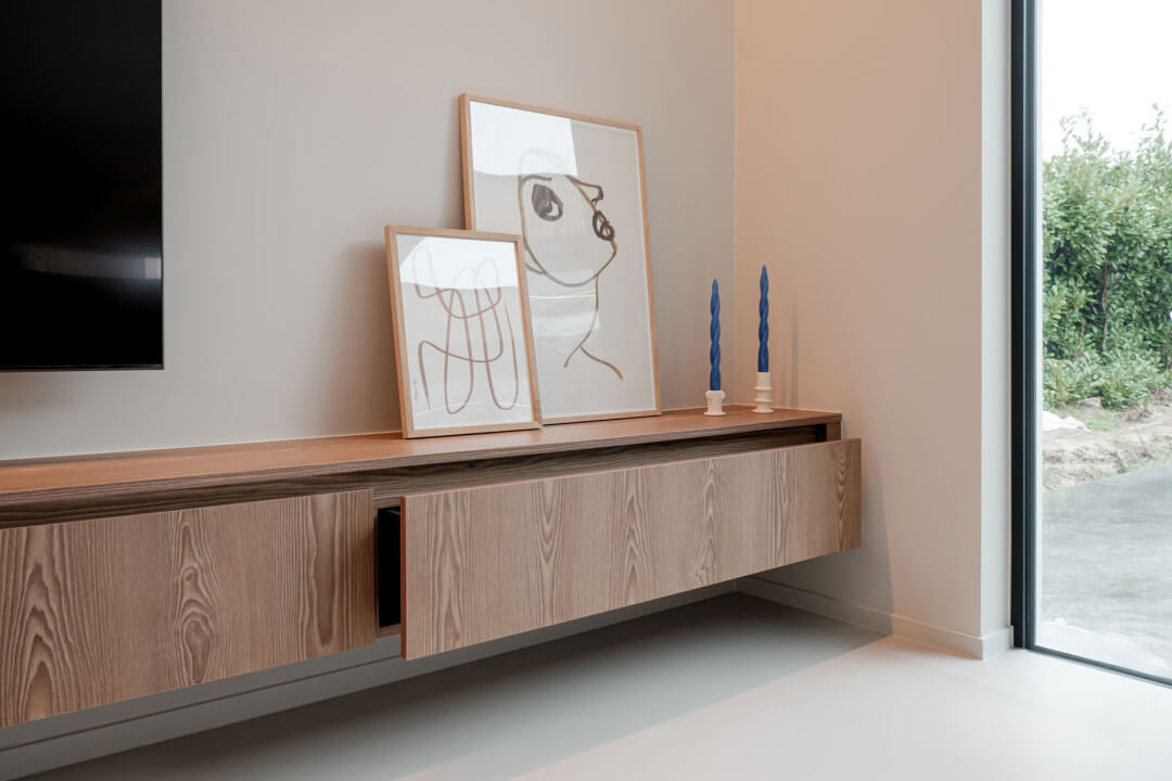 Custom floating TV unit in wood texture on the living room wall
